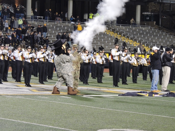 ROTC Yosef Fires the Musket Announcing the Team