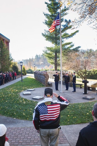 veteran's day ceremony by the flagpole on campus