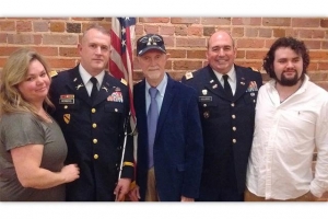 Col. Ashley Worboys, second from left, poses with wife, MaryDale Morgan Worboys; father, James Worboys; Col. Tim Sellers; and son, Hampton Worboys, after his promotion ceremony to colonel in the U.S. Army.